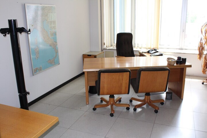 Contents of Director’s Office Including Oak Workstation with a Corduroy Upholstered Armchair,
