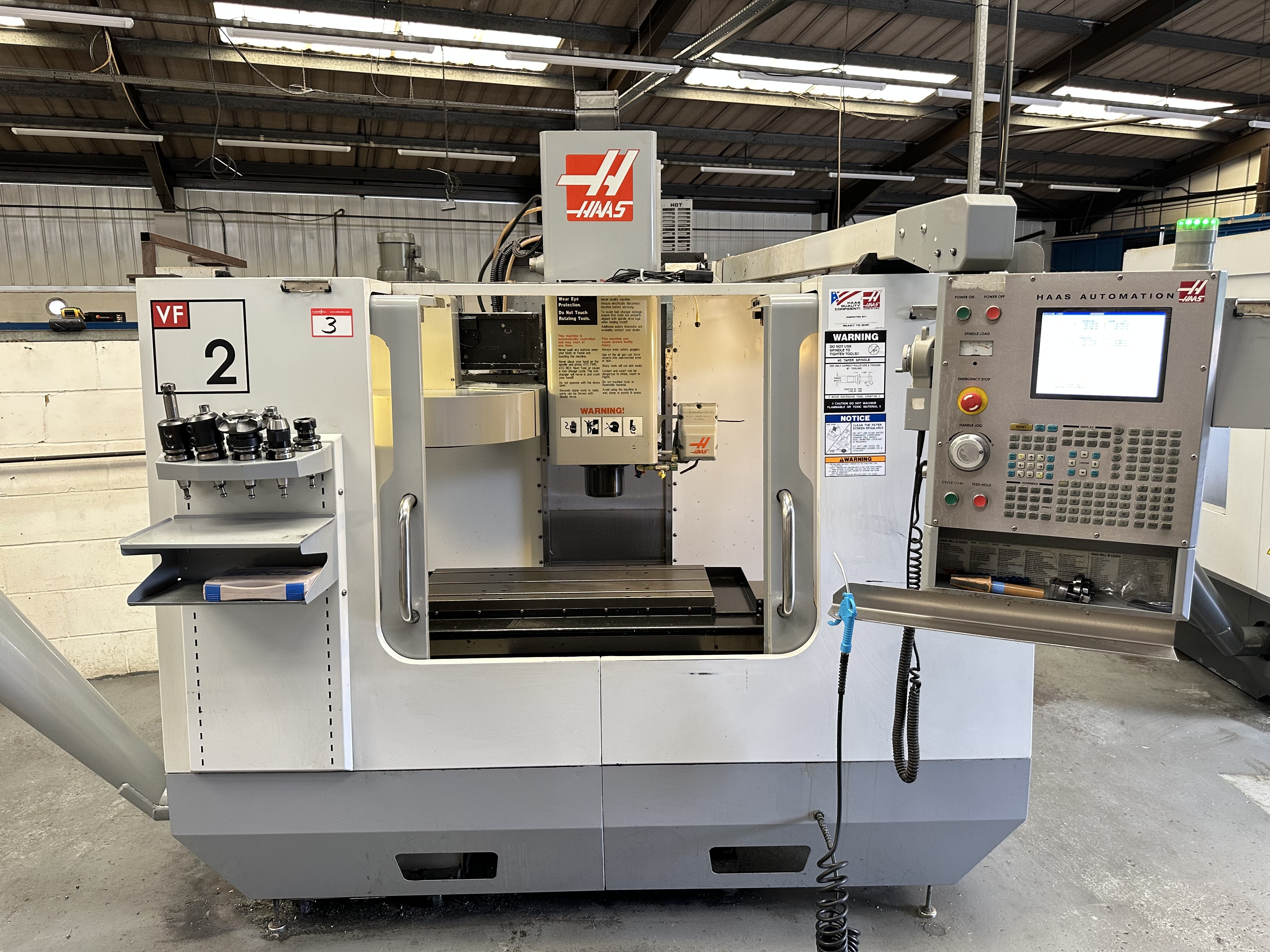 Haas VF2DE Vertical Machining Centre with Haas CNC Control. (02/2006)