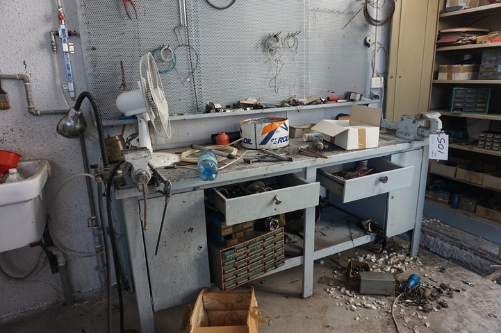 Steel Work Bench with (2) Vices and a Steel Cupboard with a quantity of spares